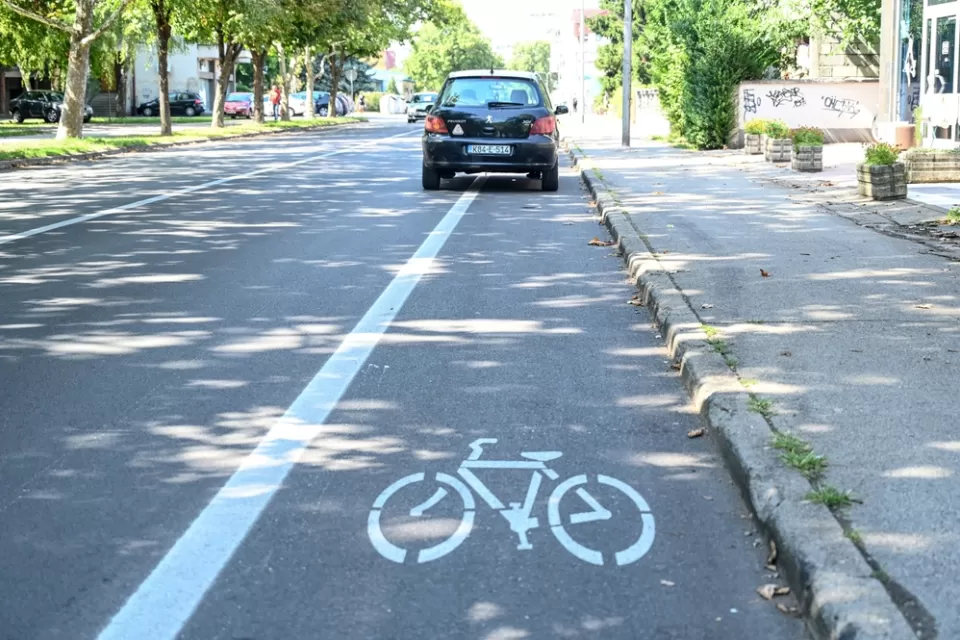 Black car parked in bike lane